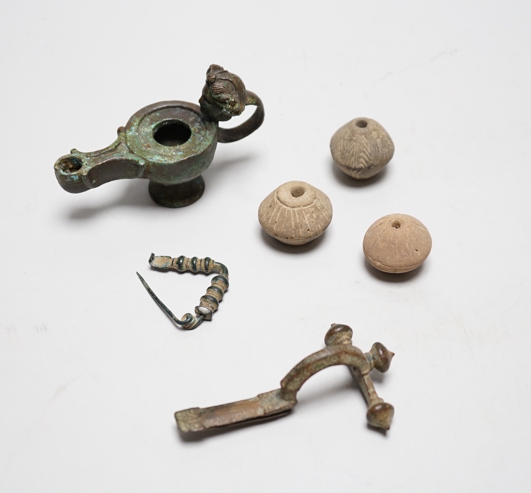 A collection of ancient bronze and terracotta items